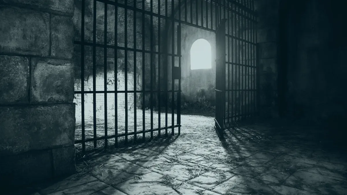 a prison cell with light shining in