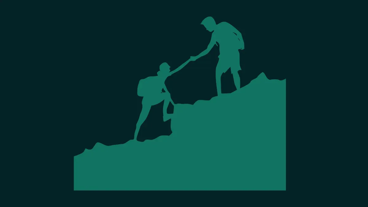 man helping climber up
